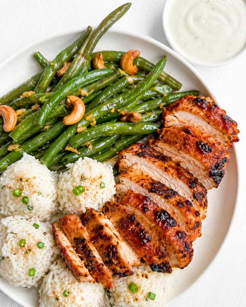 Charred Pineapple Gochujang Chicken with Coconut-Lime Crema, Coconut-Scallion Jasmine Rice Balls with Toasted Sesame Seeds, and Ginger-Garlic Green Beans with Roasted Cashews (Gluten-Free)