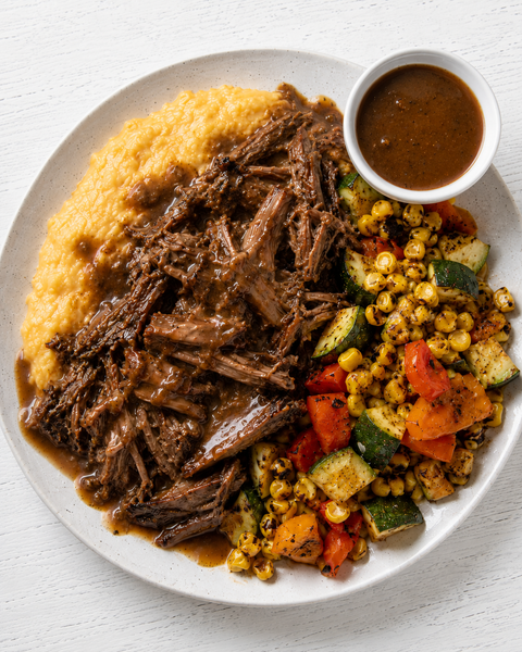 Blackened Cajun Pot Roast with Roasted Garlic-Creole Gravy, Creamy Cheddar Grits, and a Charred Corn, Zucchini & Sweet Pepper Skillet (Gluten-Free)